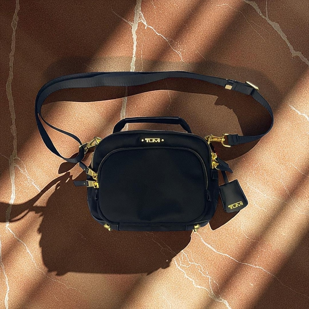 Tumi ✨Black and Gold Crossbody Bag ✨Sleek Design